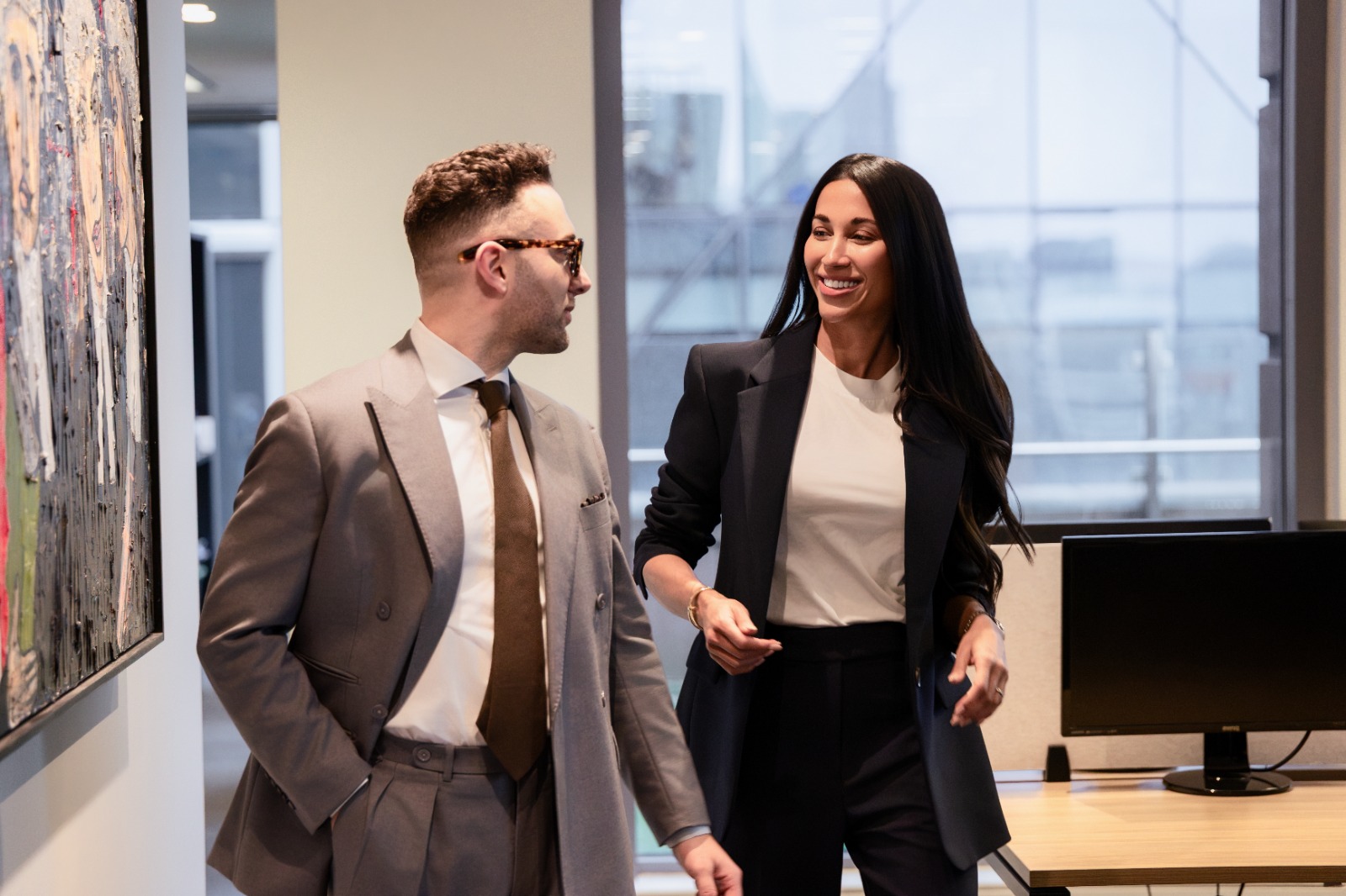 Two professionals in a private consultation at a modern office